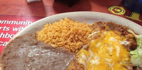 Enchilada plate with rice, beans and salad at Jaramillo's